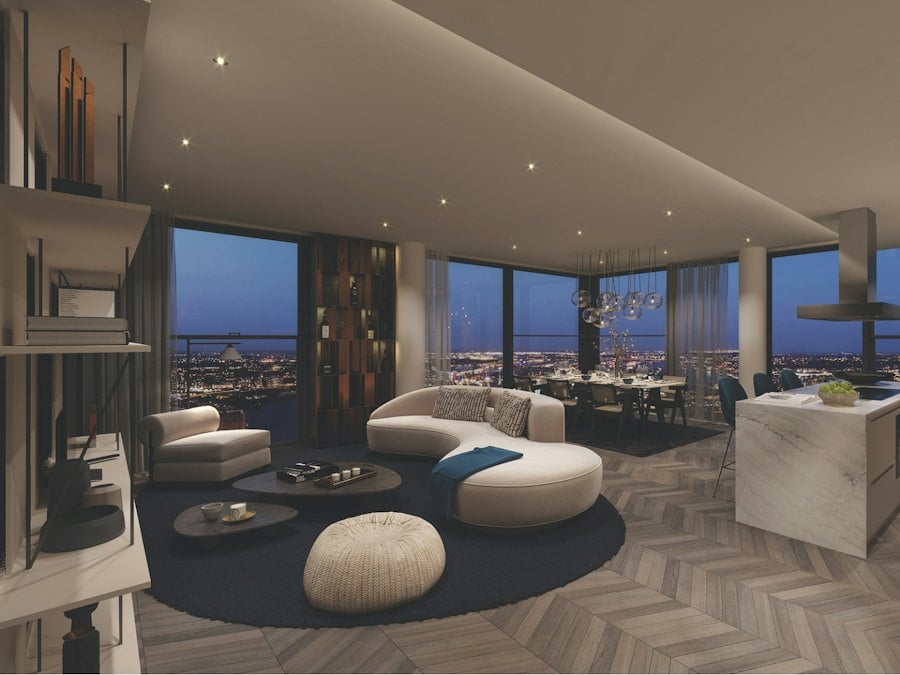 Open-plan living and dining room with city views at dusk