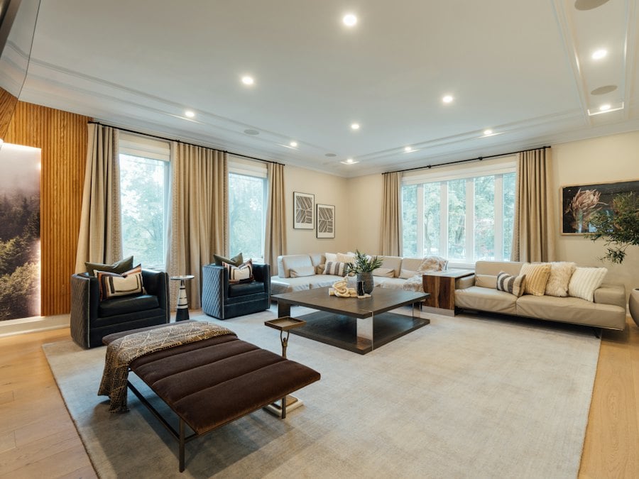 Traditional living room with tall windows and neutral furnishings